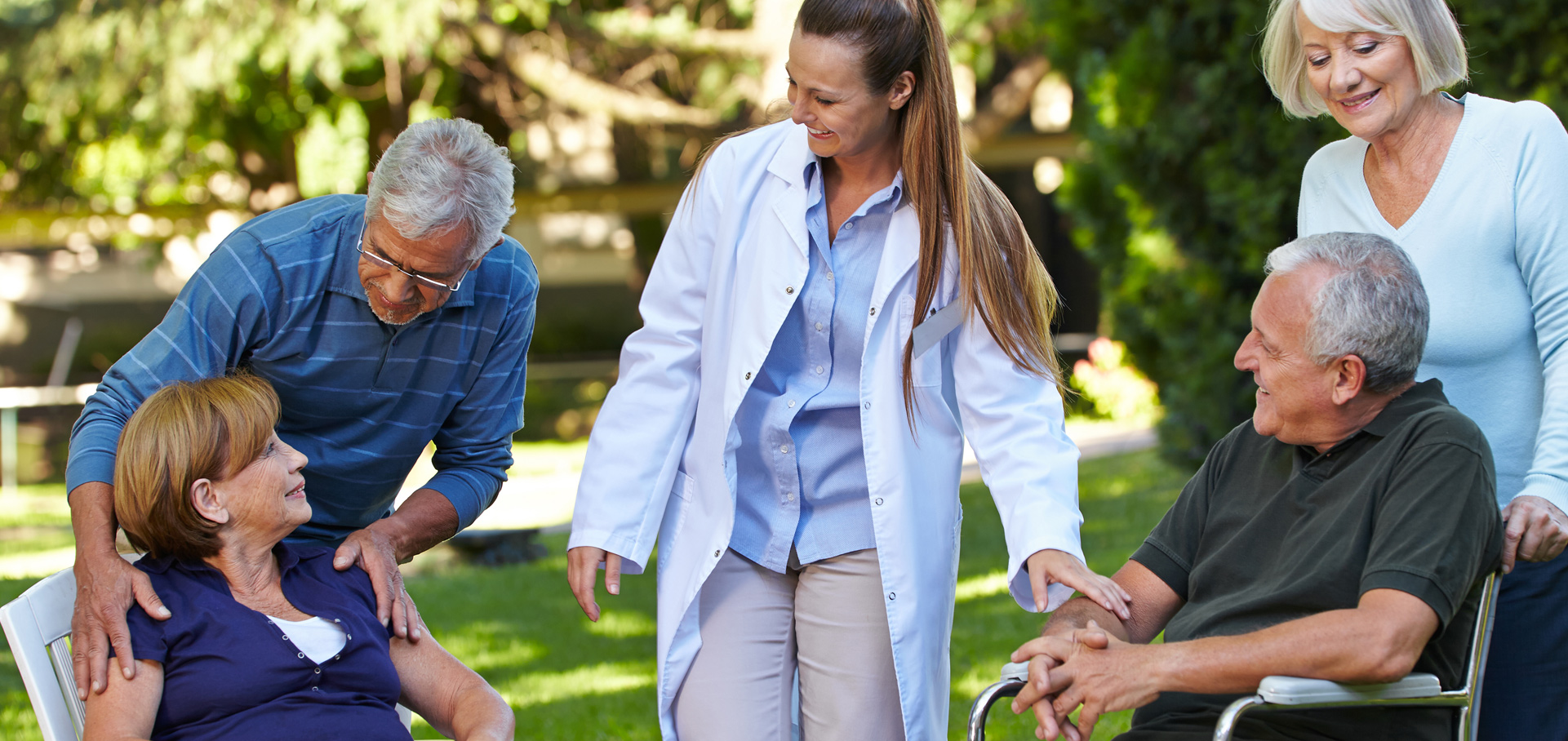 Doctor visiting with senior patients and family